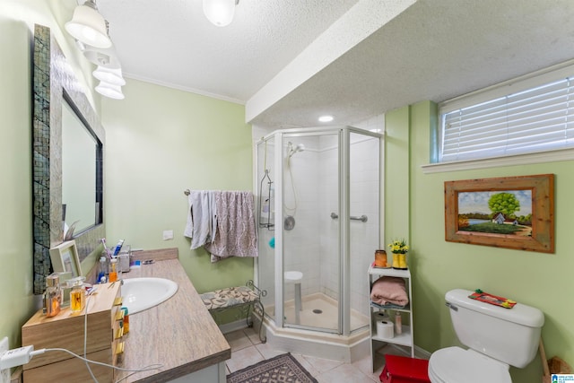 bathroom featuring vanity, crown molding, tile patterned flooring, an enclosed shower, and toilet