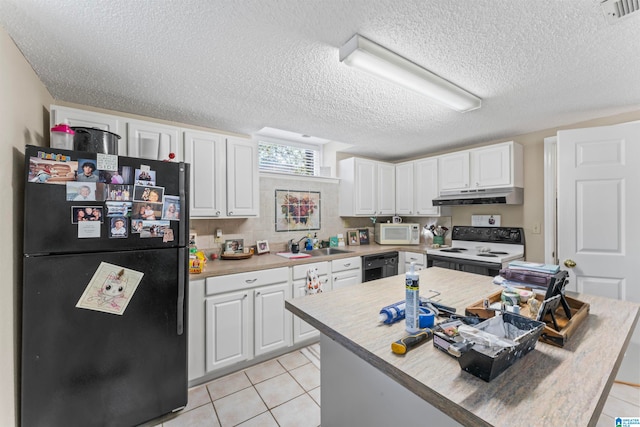 kitchen featuring light tile patterned flooring, black appliances, white cabinetry, and a textured ceiling