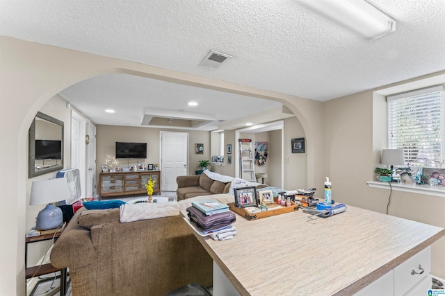 living room with a textured ceiling