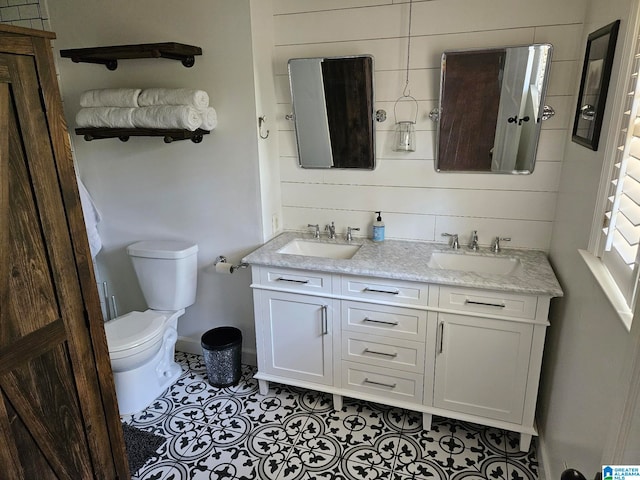 bathroom with vanity, toilet, and tile patterned flooring