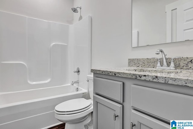 full bathroom with vanity, toilet, and shower / bathtub combination