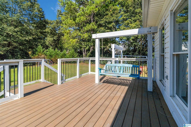 wooden terrace with a lawn