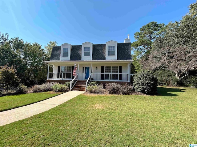 cape cod house featuring covered porch and a front yard