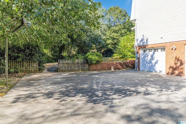 view of side of property with a garage