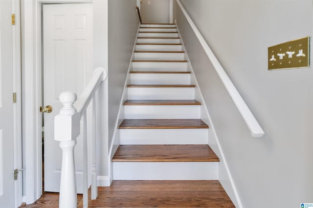 staircase featuring hardwood / wood-style flooring