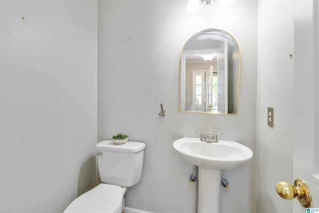 bathroom featuring sink and toilet