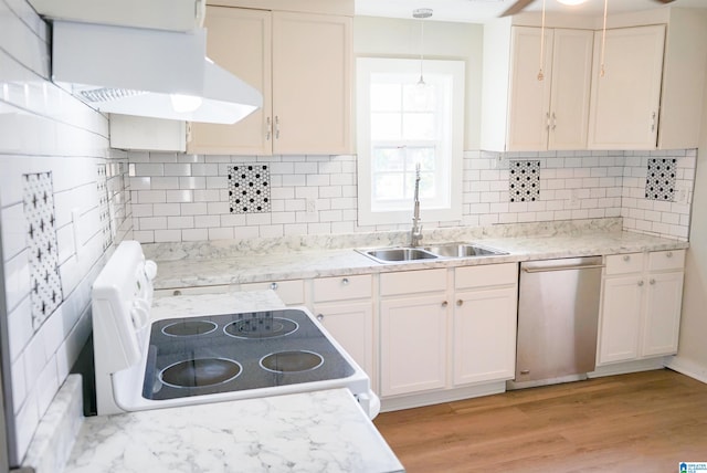 kitchen with stainless steel dishwasher, sink, pendant lighting, electric stove, and light hardwood / wood-style flooring