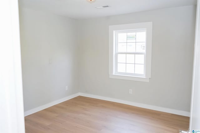 unfurnished room featuring light hardwood / wood-style floors