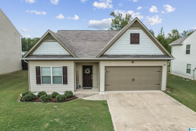 view of front of property featuring driveway, a front lawn, and an attached garage
