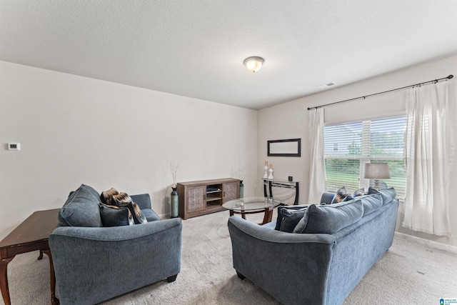 living room featuring light colored carpet and baseboards