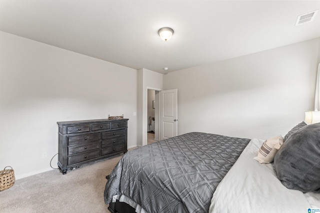 bedroom with carpet floors and baseboards