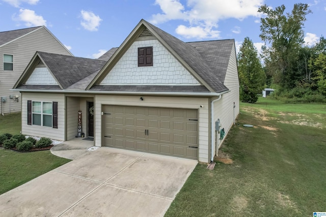 traditional-style house with an attached garage, concrete driveway, a front yard, and roof with shingles