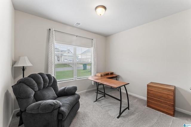 carpeted office featuring baseboards