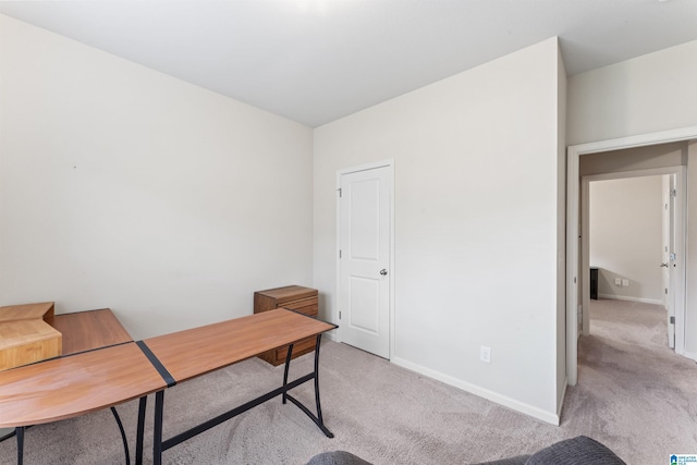 office with light colored carpet and baseboards