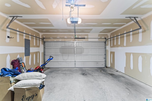 garage with electric panel and a garage door opener