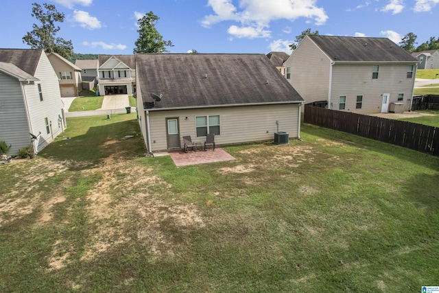 back of property with a residential view, central air condition unit, and a patio area