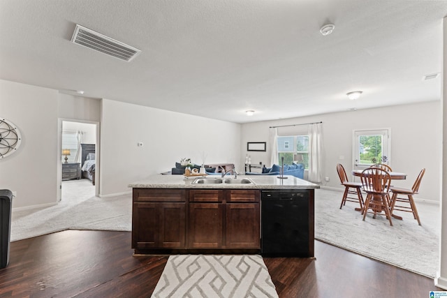 kitchen with black dishwasher, a sink, open floor plan, dark brown cabinetry, and light countertops