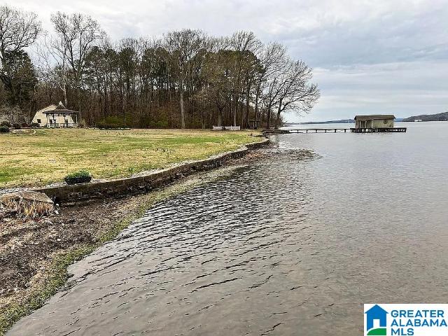 property view of water with a gazebo