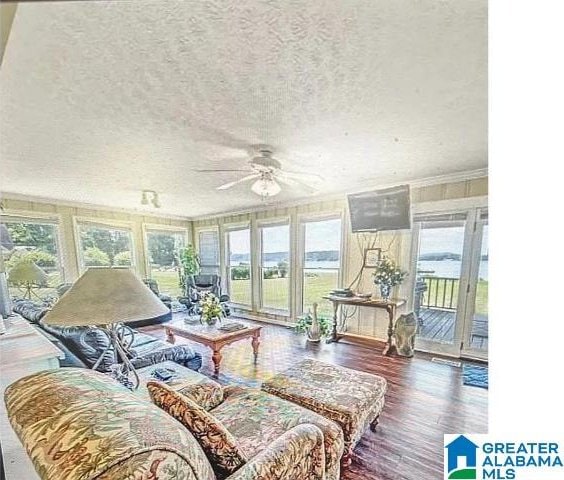 sunroom / solarium with ceiling fan and a wealth of natural light