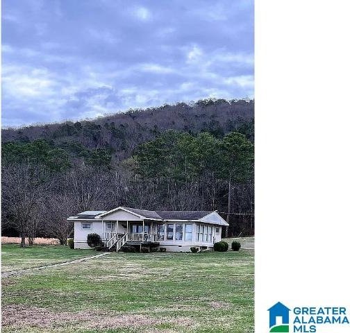 view of front of property with a front lawn