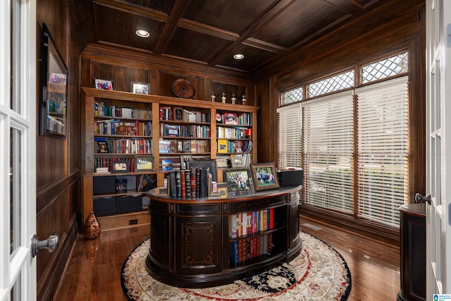 office area with wood walls, coffered ceiling, wooden ceiling, and wood-type flooring