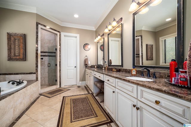 bathroom with vanity, shower with separate bathtub, ornamental molding, and tile patterned flooring