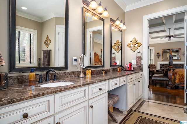 bathroom with beamed ceiling, vanity, coffered ceiling, and ornamental molding