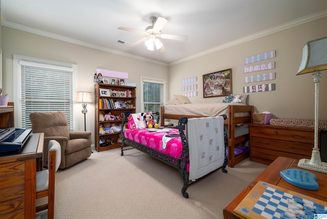 carpeted bedroom featuring ceiling fan, ornamental molding, and multiple windows