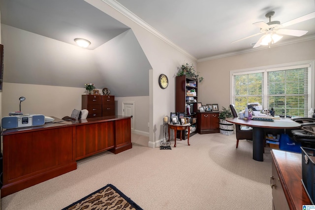 carpeted home office featuring lofted ceiling, ornamental molding, and ceiling fan