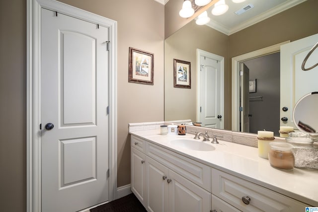 bathroom with vanity and crown molding