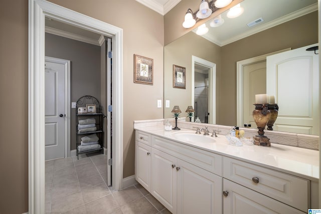 bathroom featuring vanity, ornamental molding, and tile patterned floors