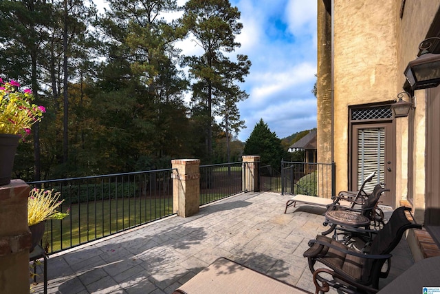 view of patio with a balcony