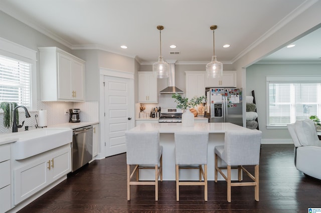 kitchen with white cabinets, stainless steel appliances, dark hardwood / wood-style floors, and a kitchen island