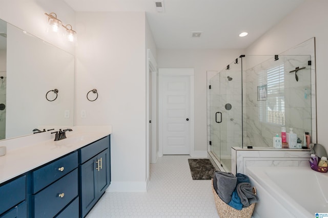 bathroom featuring vanity, plus walk in shower, and tile patterned floors