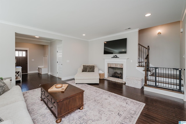 living room featuring wood-type flooring and crown molding