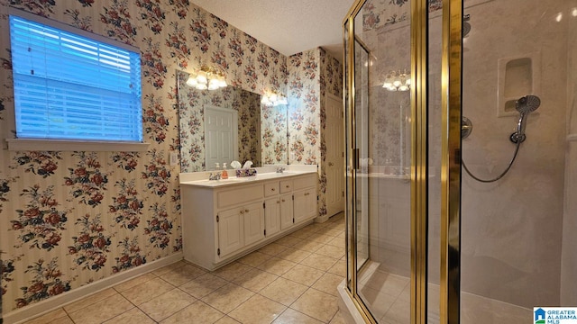 bathroom with vanity, a textured ceiling, tile patterned flooring, and an enclosed shower