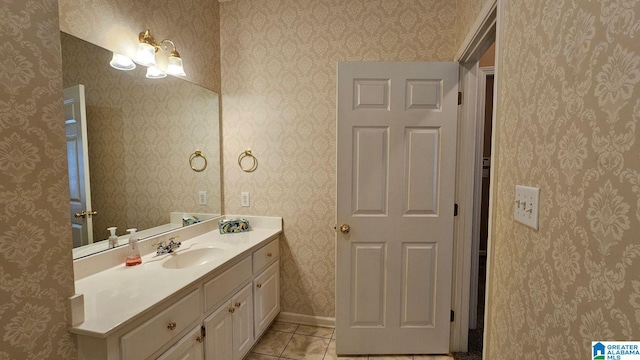 bathroom with tile patterned floors and vanity