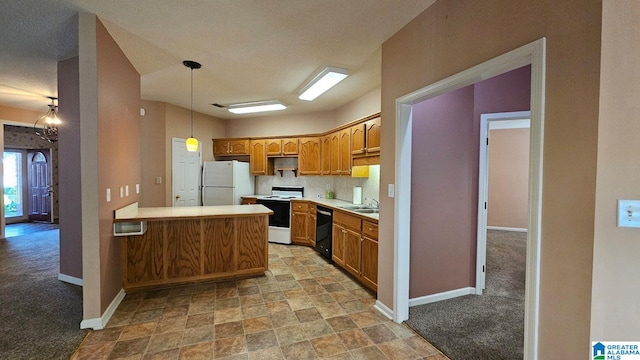 kitchen with hanging light fixtures, sink, white appliances, a textured ceiling, and light carpet