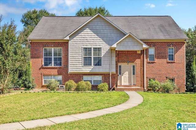 bi-level home featuring a front lawn