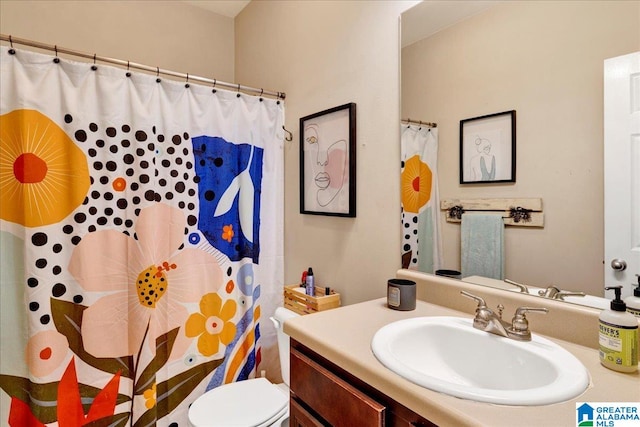 bathroom with walk in shower, vanity, and toilet