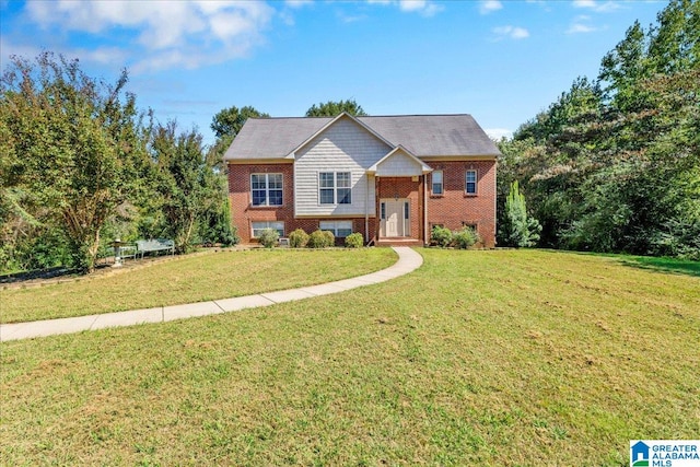 split foyer home featuring a front lawn