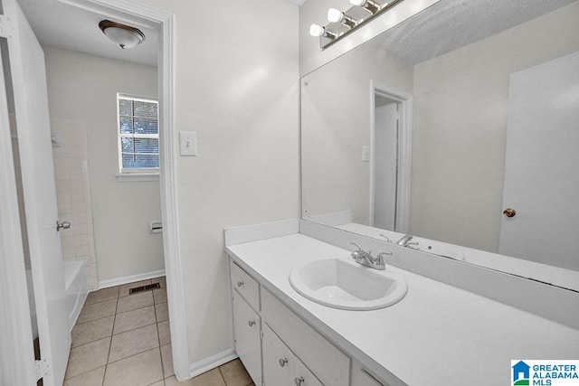 bathroom with vanity and tile patterned flooring