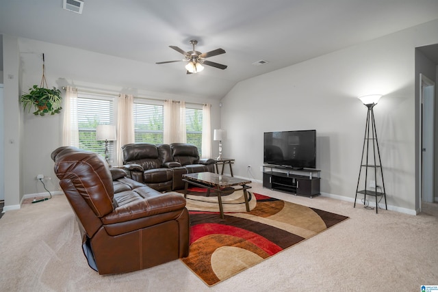 carpeted living room featuring vaulted ceiling and ceiling fan