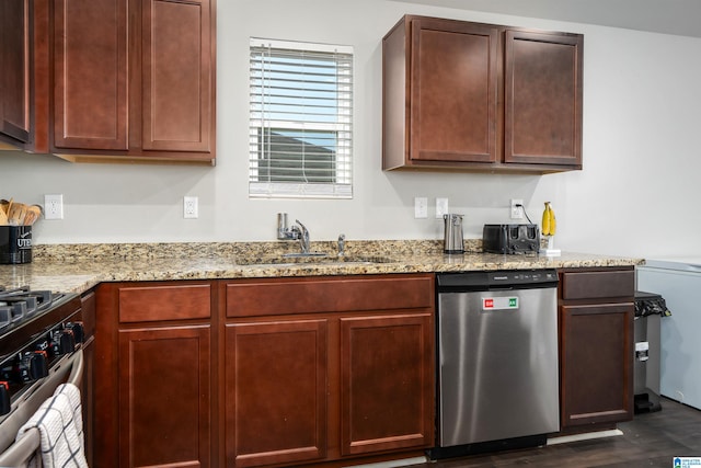 kitchen with light stone countertops, stainless steel appliances, dark hardwood / wood-style floors, and sink