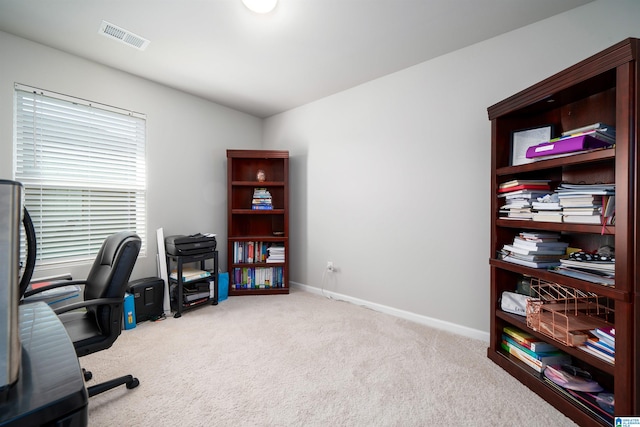 office area featuring light colored carpet