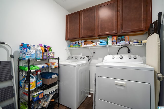 laundry area with cabinets, independent washer and dryer, and dark hardwood / wood-style floors