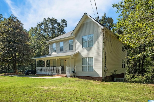 view of front of property featuring a porch and a front lawn