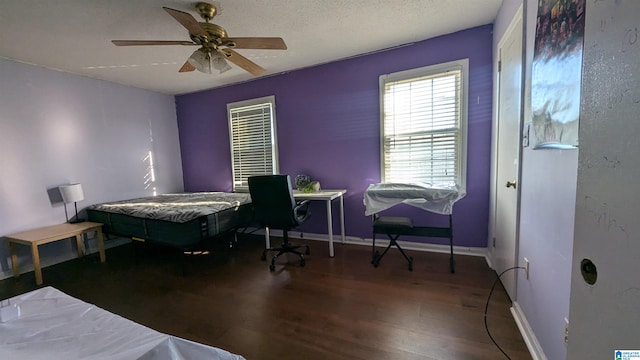 bedroom with ceiling fan and hardwood / wood-style floors