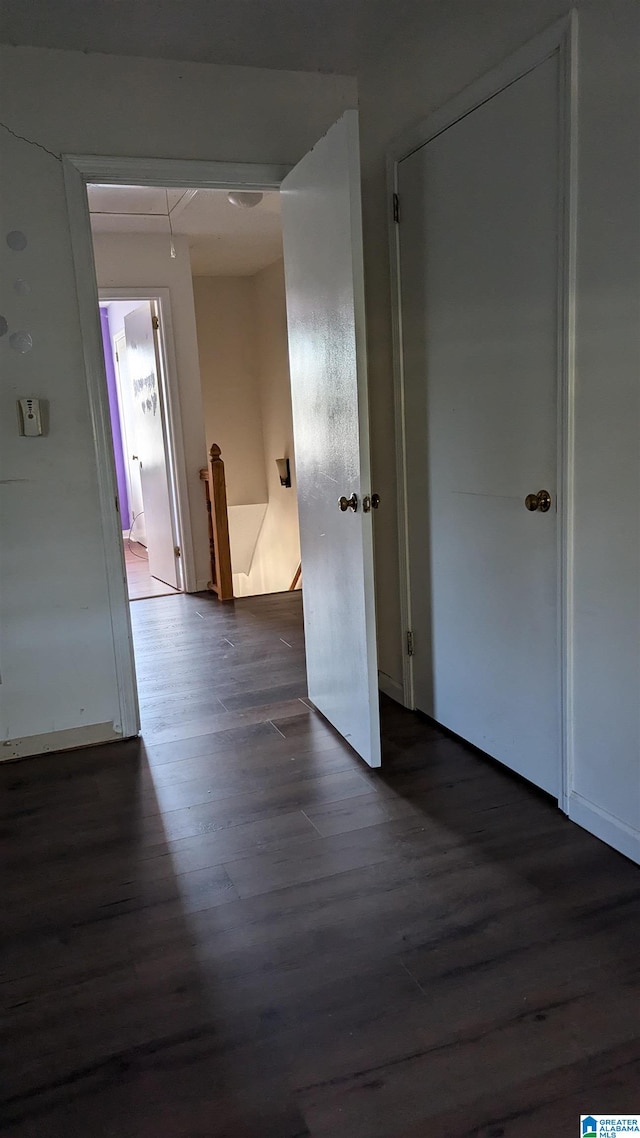 spare room with dark hardwood / wood-style floors