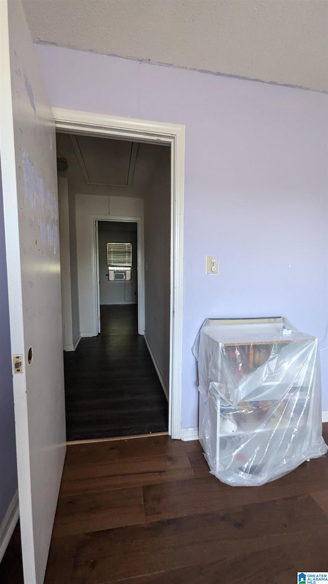 corridor featuring dark wood-type flooring